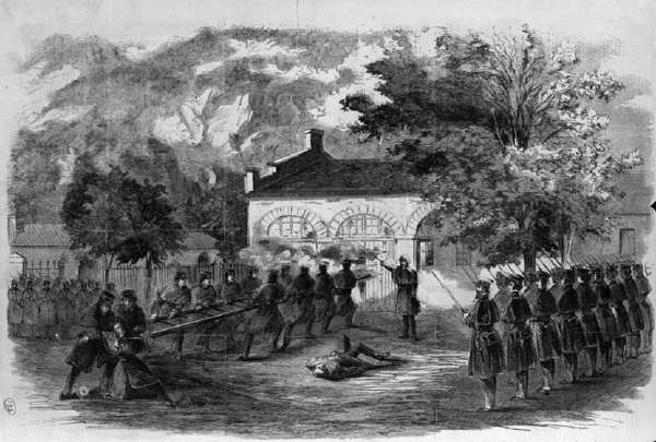 The Harper's Ferry Insurrection--the U.S. Marines Storming the Engine House--Insurgents Firing Through Holes in the Doors