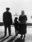 Immigrant Family Looking at The Statue of Liberty 