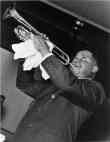 Louis Armstrong, Half-Length Portrait, Facing Left, Playing Trumpet